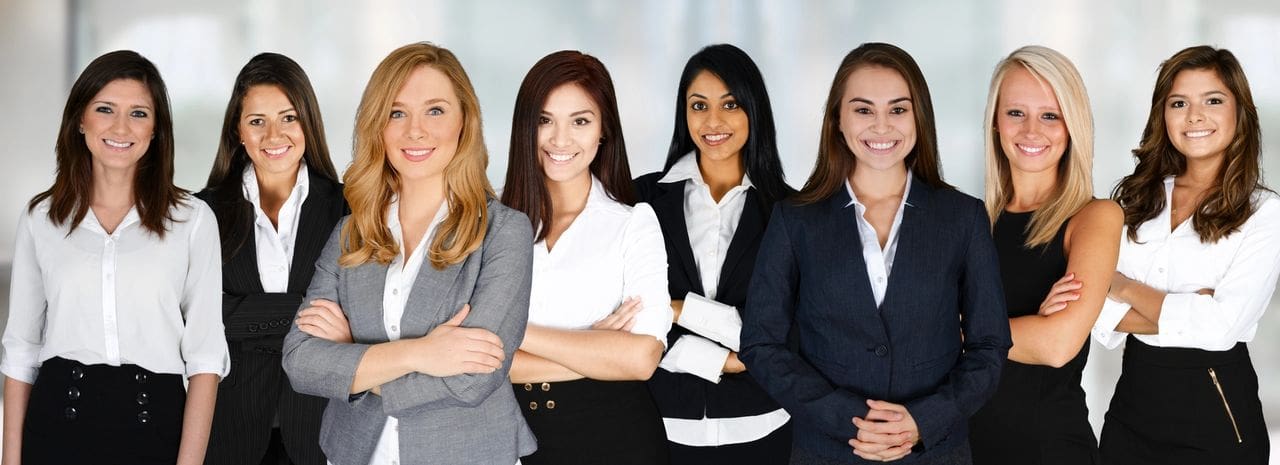 A group of women standing next to each other.